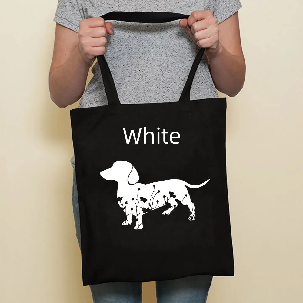 Sausage dog printed canvas bag in black with white dog design on front, sturdy tote for everyday use