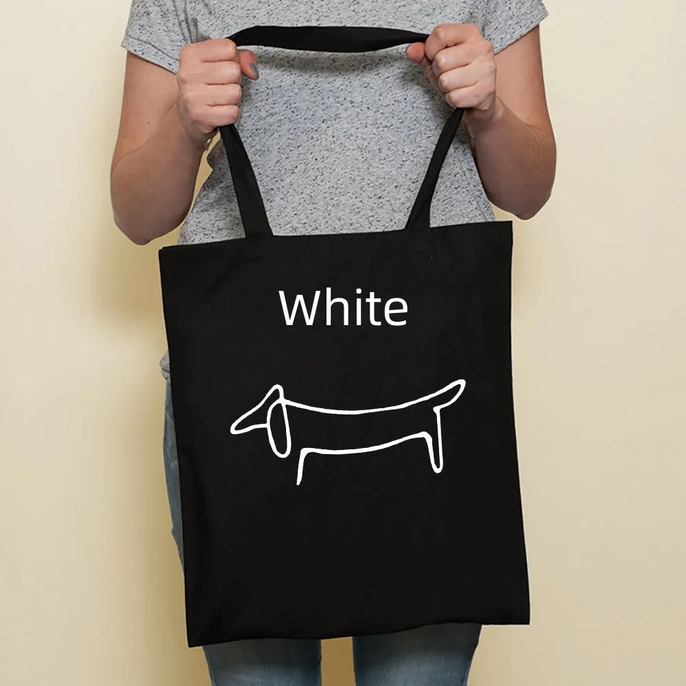Sausage dog printed canvas bag in black with white dog design on front, sturdy tote for everyday use