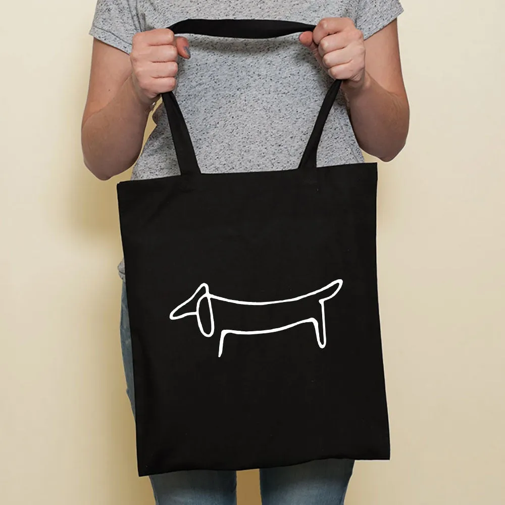 Sausage dog printed canvas bag in black with white dog design on front, sturdy tote for everyday use