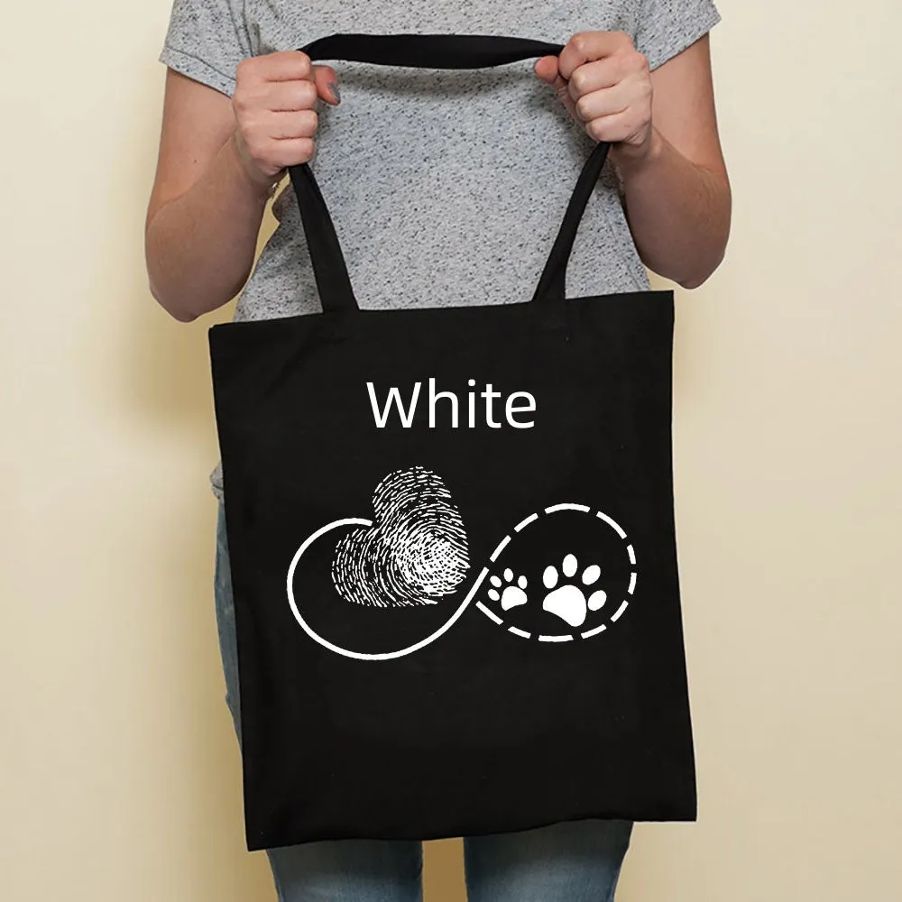 Sausage dog printed canvas bag in black with white dog design on front, sturdy tote for everyday use