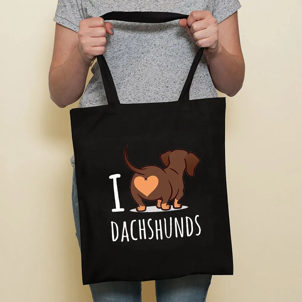 Sausage dog printed canvas bag in black with white dog design on front, sturdy tote for everyday use