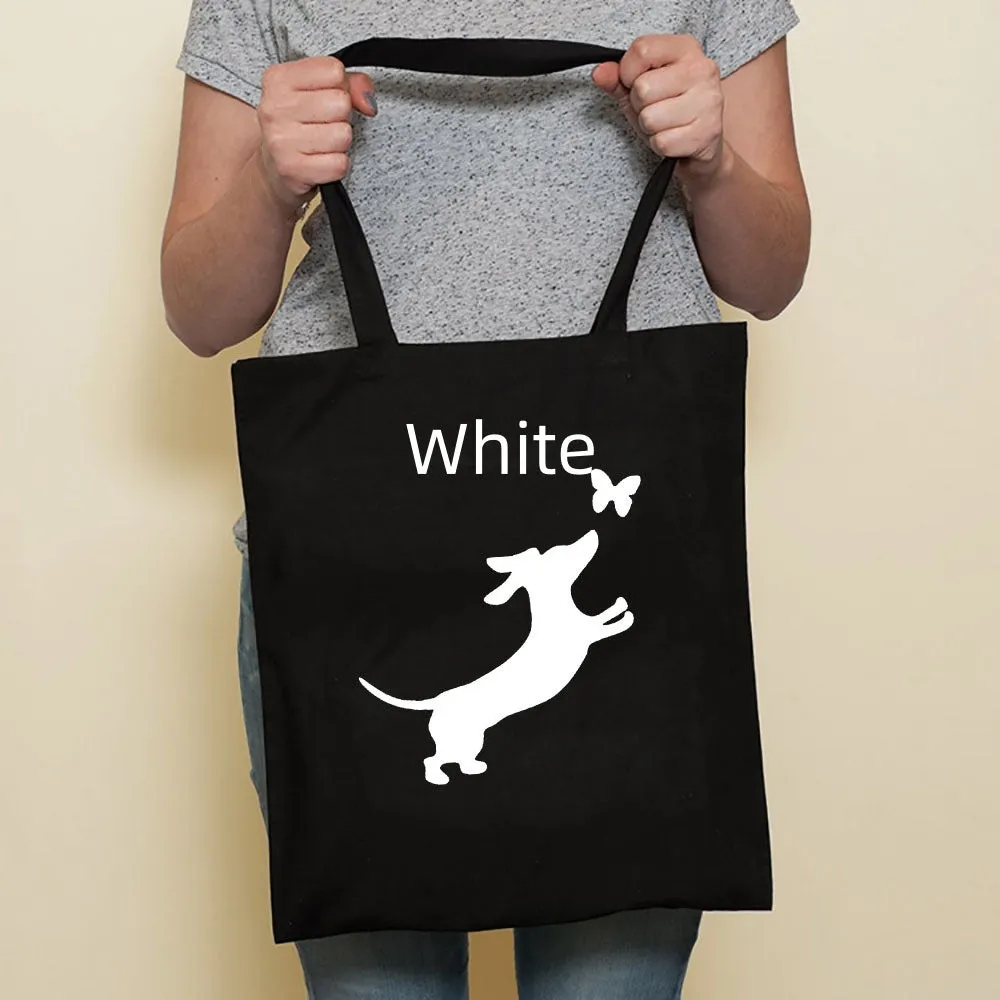 Sausage dog printed canvas bag in black with white dog design on front, sturdy tote for everyday use