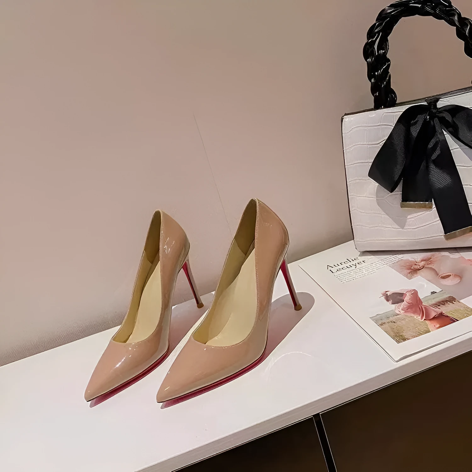 Women's pointed low-cut patent leather stiletto heels in black solid colour with stiletto heel and pointed toe