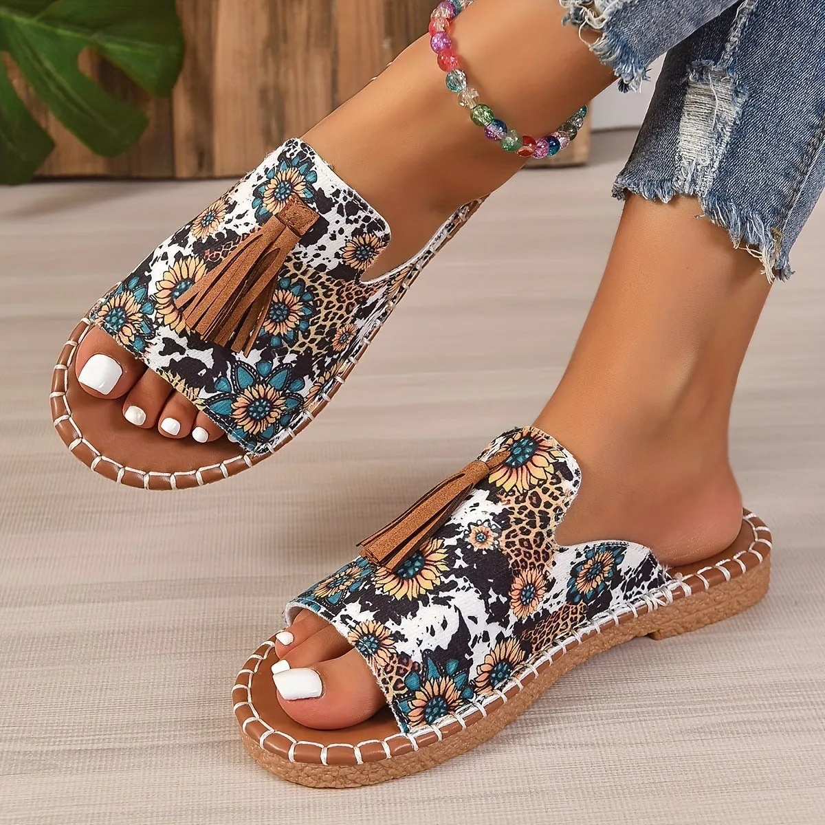Women's tassel flat sandals in first layer cowhide with grape particle accents, Roman style, fish mouth toe, available in multiple colours