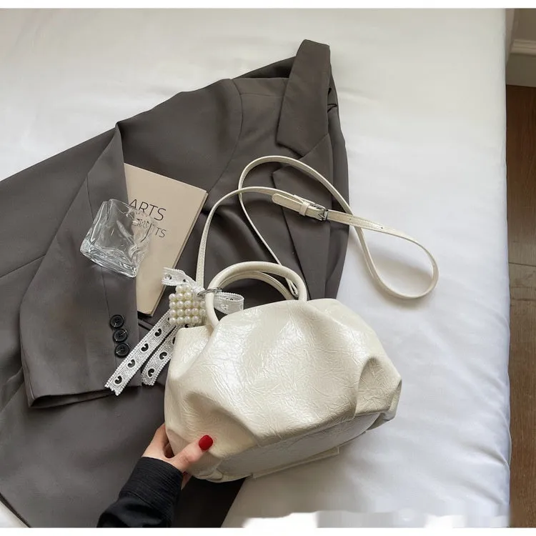 Portable solid colour cloud fashion shoulder small bag in urban simplicity bucket shape with slit pocket, PU material, beige colour