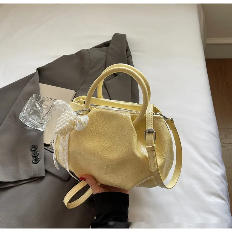 Portable solid colour cloud fashion shoulder small bag in urban simplicity bucket shape with slit pocket, PU material, beige colour