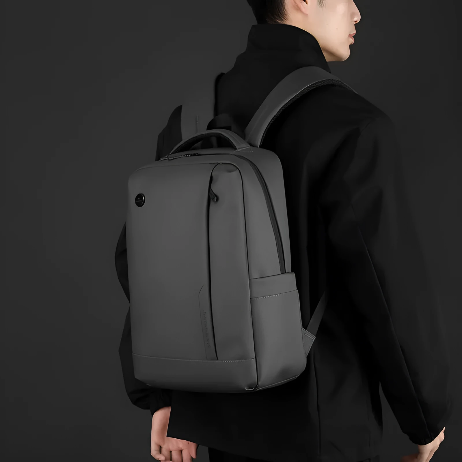 Men's large capacity nylon computer backpack in black with curved shoulder strap and polyester lining