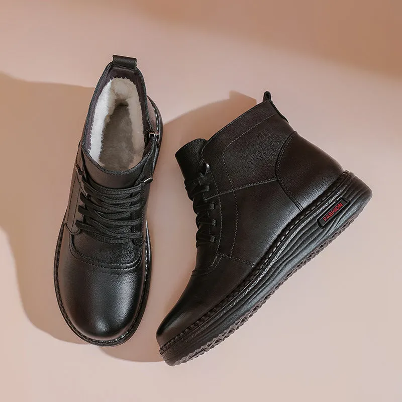 Mother cowhide leather ankle boots with wool lining, platform heel, and side zipper in black