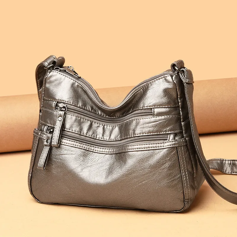 Women's washed leather crossbody bag in solid colour, retro messenger style with adjustable strap and soft handle