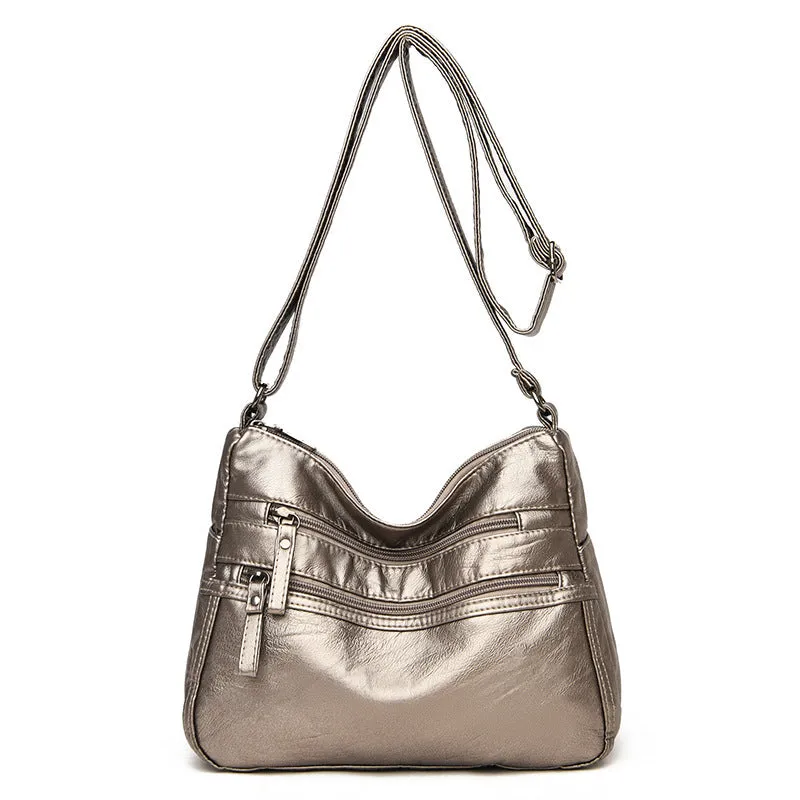 Women's washed leather crossbody bag in solid colour, retro messenger style with adjustable strap and soft handle