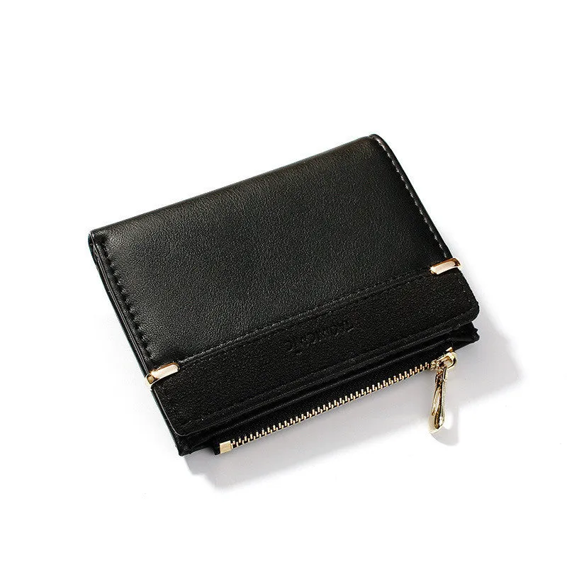 Black ladies bi-fold wallet with a gold zipper, open to show multiple card slots and a coin compartment.
