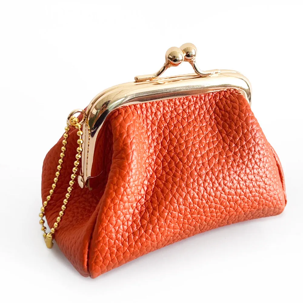 Genuine leather mini coin wallet in solid colour with visible sewing thread detail – urban simplicity design