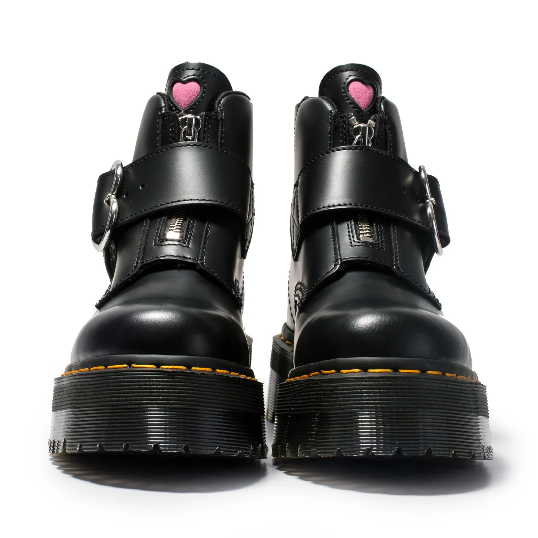 Women's black leather ankle boots with chunky heel, lace-up front, side zip, and belt buckle detail on a waterproof platform