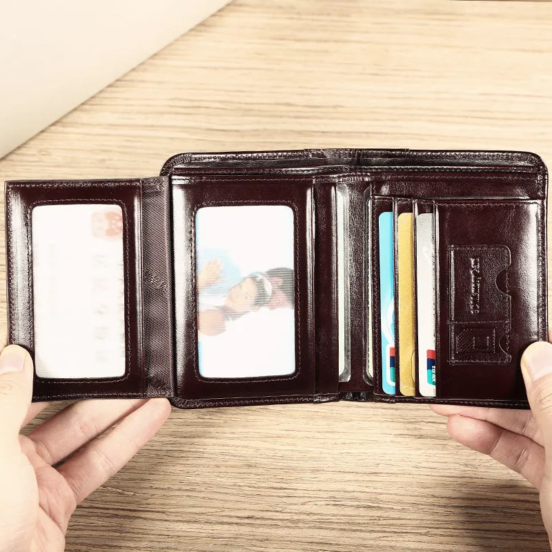 Men's black full-grain leather bifold wallet open, showing card slots, zip coin pocket, and banknote section.