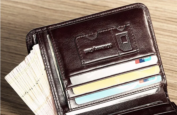 Men's black full-grain leather bifold wallet open, showing card slots, zip coin pocket, and banknote section.