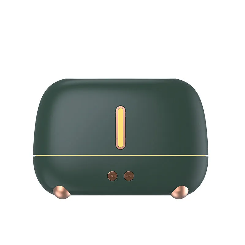 Dark grey flame humidifier with realistic orange LED light and mist output on a wooden table
