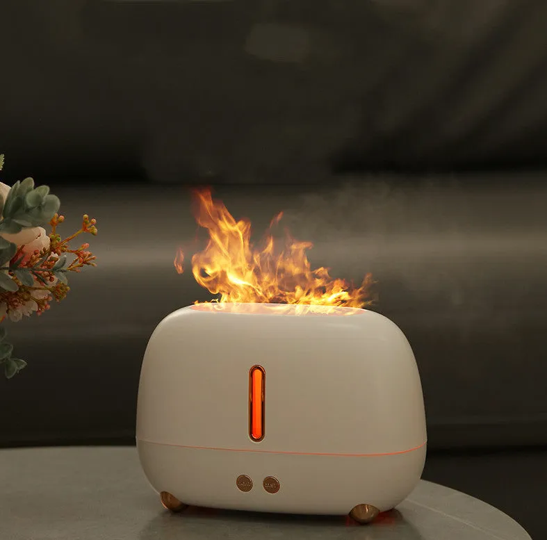 Dark grey flame humidifier with realistic orange LED light and mist output on a wooden table