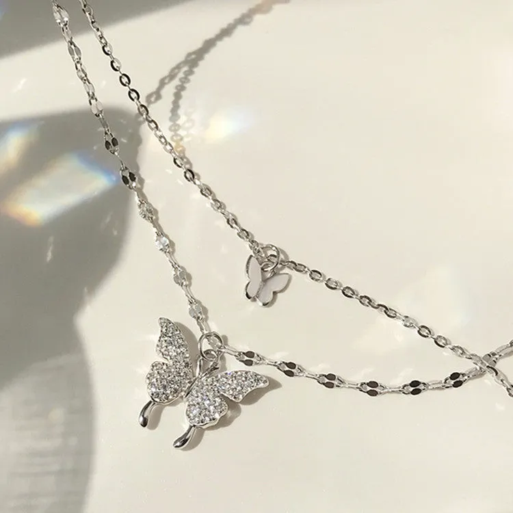 Silver colour double layer clavicle chain necklace with shiny butterfly pendant on copper base