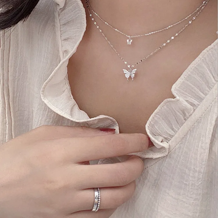 Silver colour double layer clavicle chain necklace with shiny butterfly pendant on copper base