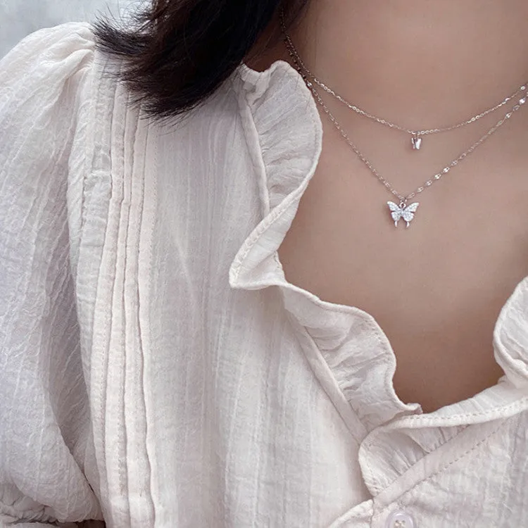 Silver colour double layer clavicle chain necklace with shiny butterfly pendant on copper base