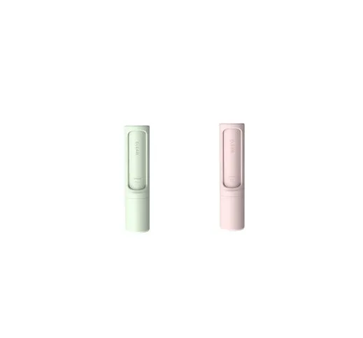 Rotating cylinder electrostatic pet hair removal brush in light pink with ABS body on a white background