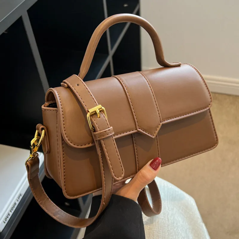Women's PU leather messenger bag in neutral colour with file organiser interior and sandwich pocket