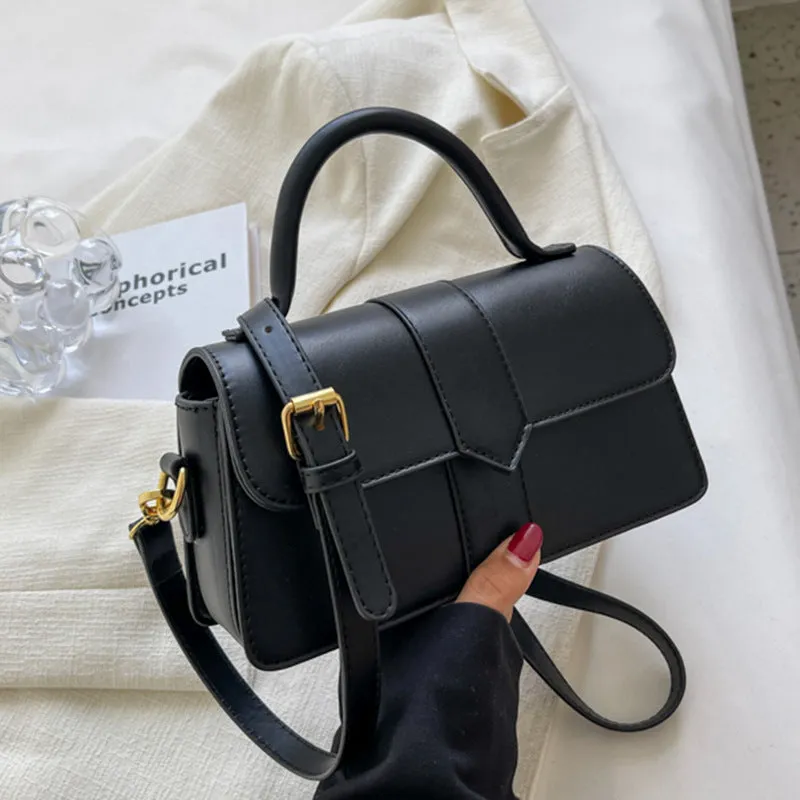 Women's PU leather messenger bag in neutral colour with file organiser interior and sandwich pocket