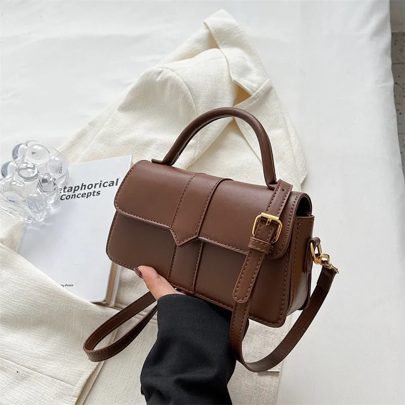 Women's PU leather messenger bag in neutral colour with file organiser interior and sandwich pocket