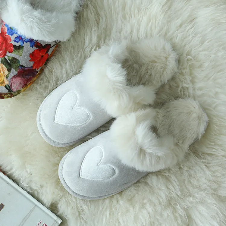 Couple wearing warm beige suede wool slippers with non-slip rubber sole indoors