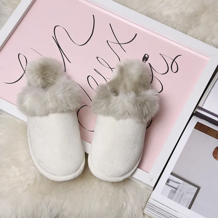 Couple wearing warm beige suede wool slippers with non-slip rubber sole indoors