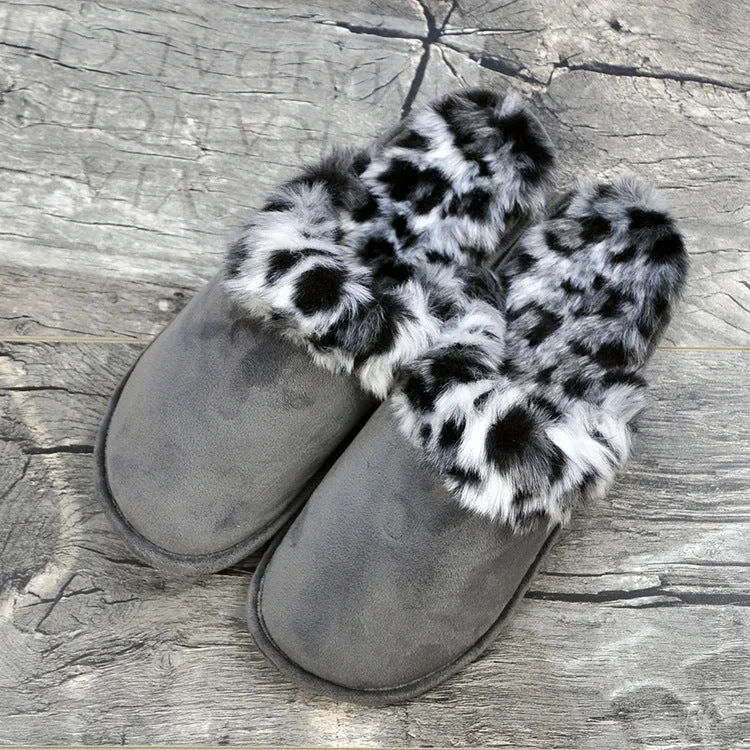 Couple wearing warm beige suede wool slippers with non-slip rubber sole indoors