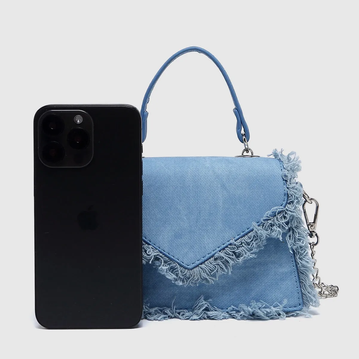 Retro tassel mini crossbody bag in denim blue, PU material, crossbody strap, compact size for women's daily use