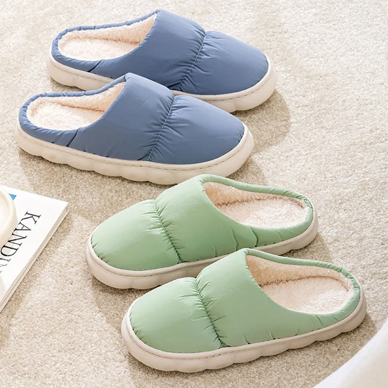 A pair of thick-soled down cotton slippers for men and women in a choice of colours, featuring a non-slip rubber sole.