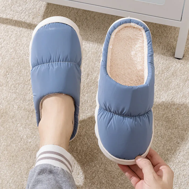 A pair of thick-soled down cotton slippers for men and women in a choice of colours, featuring a non-slip rubber sole.