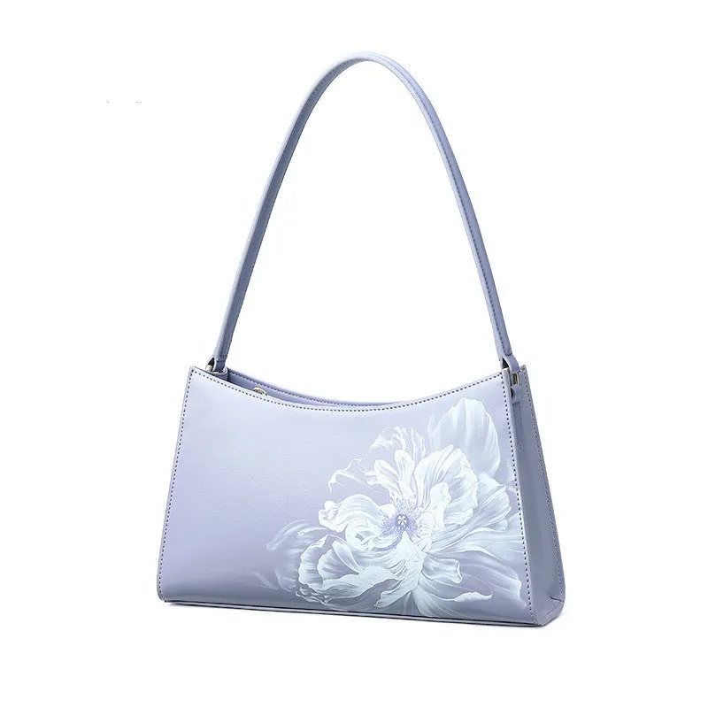 Light purple cowhide leather handbag with zipper closure, compact size for everyday use