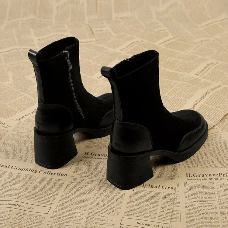 Women's black Martin boots with chunky heel and thick rubber sole, side view
