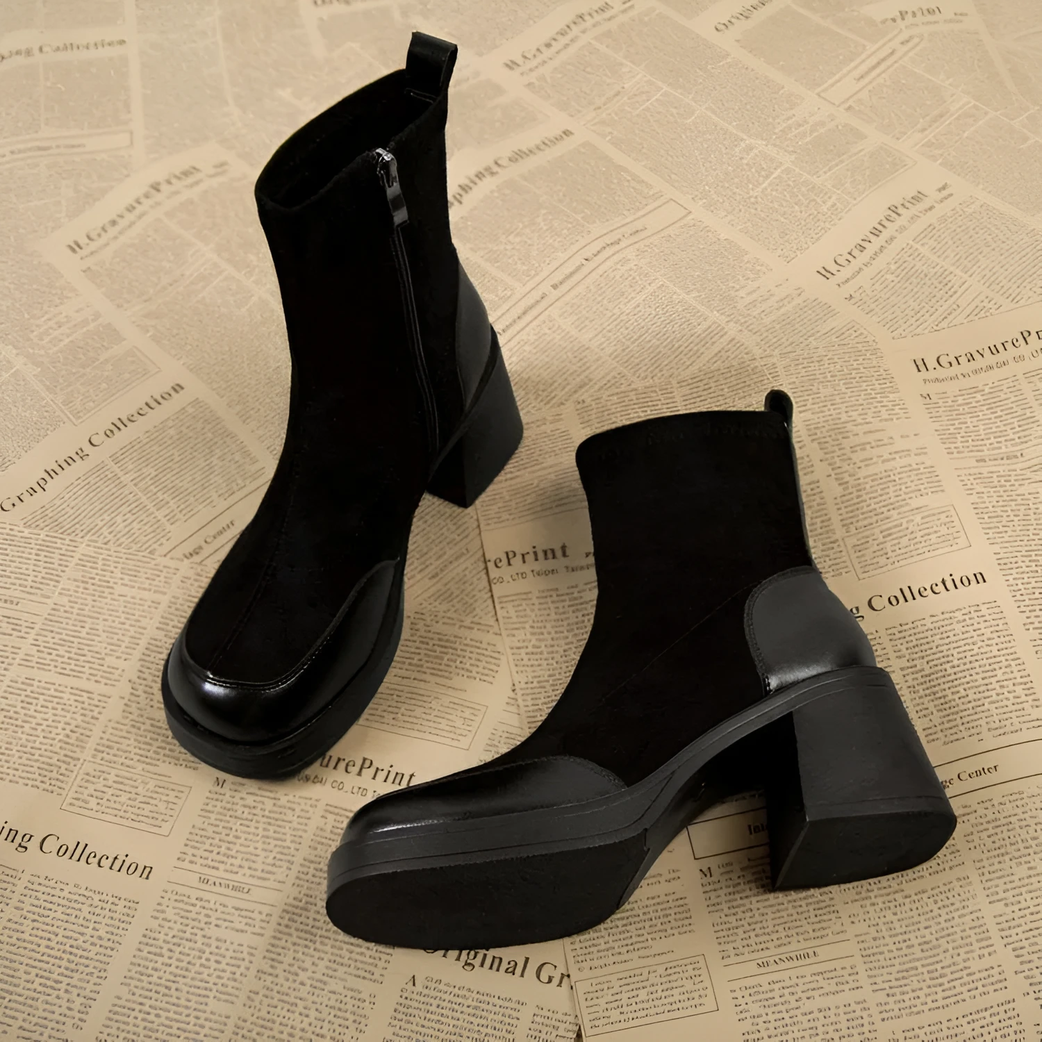 Women's black Martin boots with chunky heel and thick rubber sole, side view