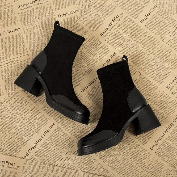 Women's black Martin boots with chunky heel and thick rubber sole, side view