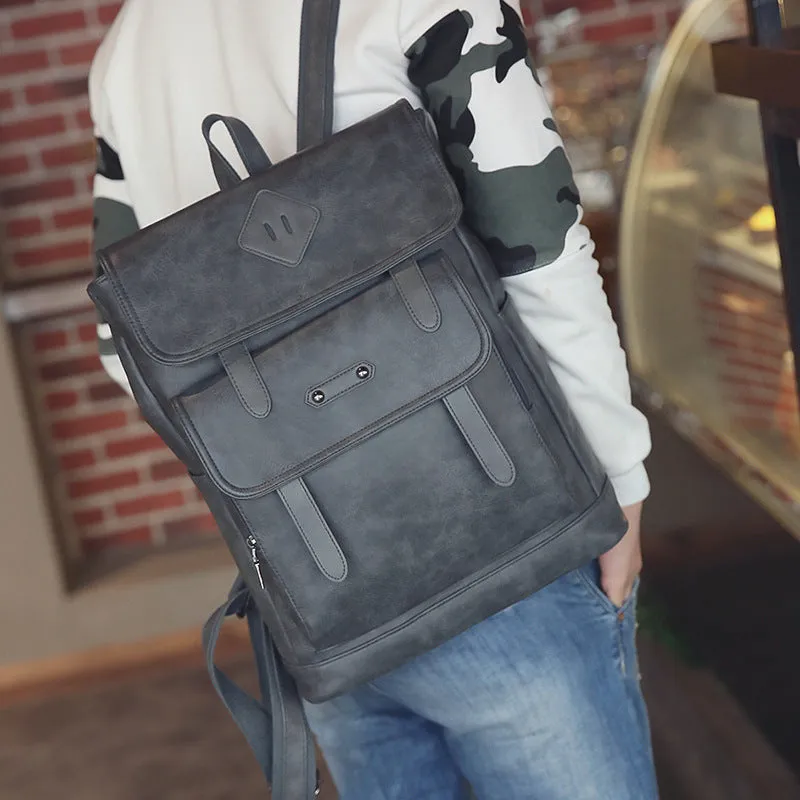 Gray leather retro laptop backpack for men with compact 30cm by 20cm by 10cm dimensions