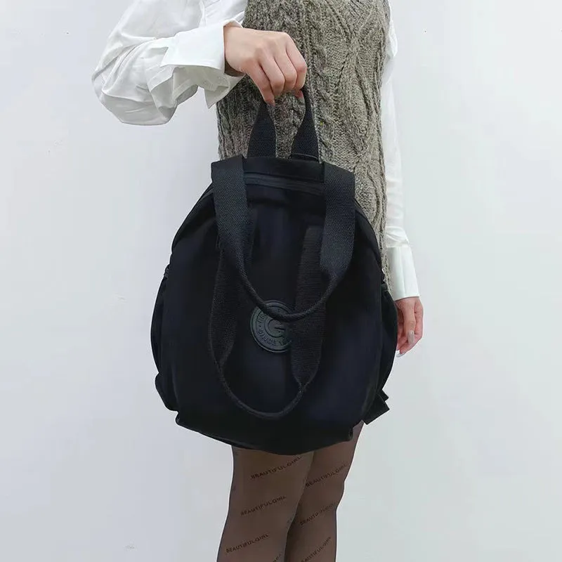 Black nylon large capacity multifunctional bag with backpack, shoulder, and handbag modes for women