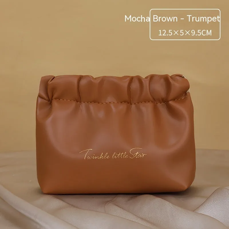 Large capacity PU leather travel toiletry bag in caramel mocha colour showing dry wet separation compartments.