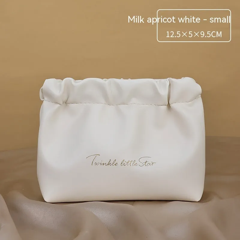 Large capacity PU leather travel toiletry bag in caramel mocha colour showing dry wet separation compartments.