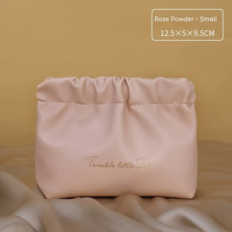 Large capacity PU leather travel toiletry bag in caramel mocha colour showing dry wet separation compartments.