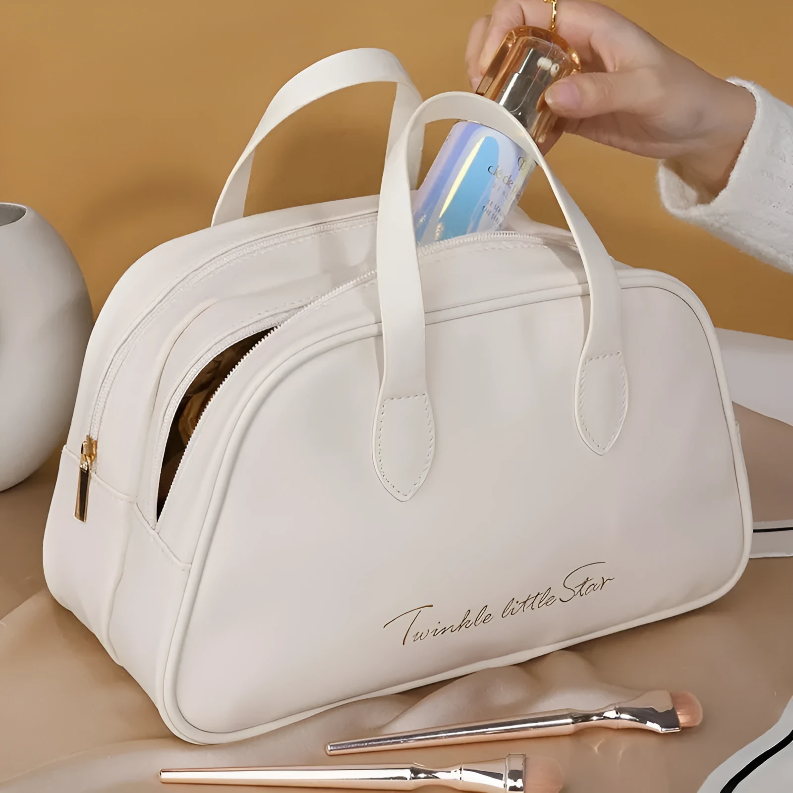 Large capacity PU leather travel toiletry bag in caramel mocha colour showing dry wet separation compartments.
