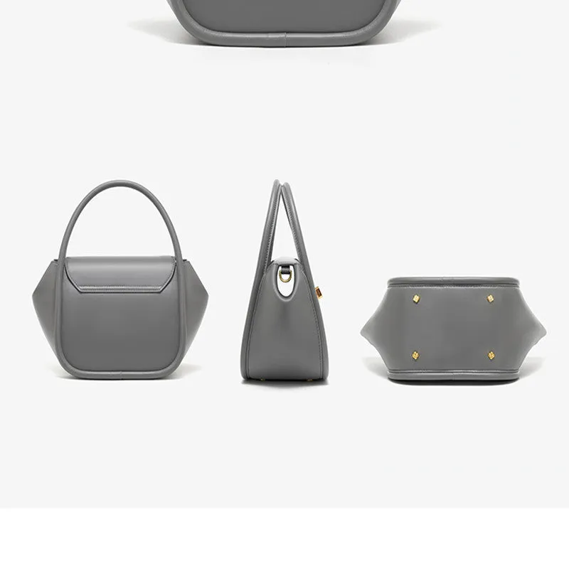 Women's leather wing shape tote bag with cross-body strap in four colour options showing buckle detail