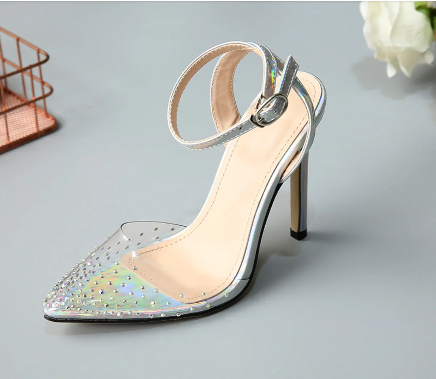 Gold glitter pointed toe stiletto sandals for women on a white background