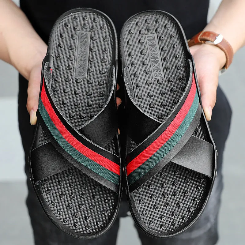 Men's white cowhide leather flip-flops with a PU sole on a sandy beach