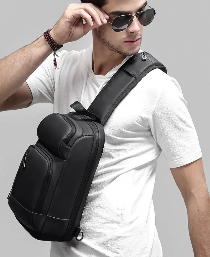 Black PVC outdoor leisure shoulder bag with a single strap, showing dedicated pockets for ID, phone, and computer.