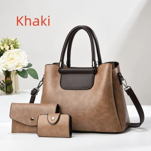 Large PU leather handbag set in horizontal square shape with matching medium and small pouches on white background