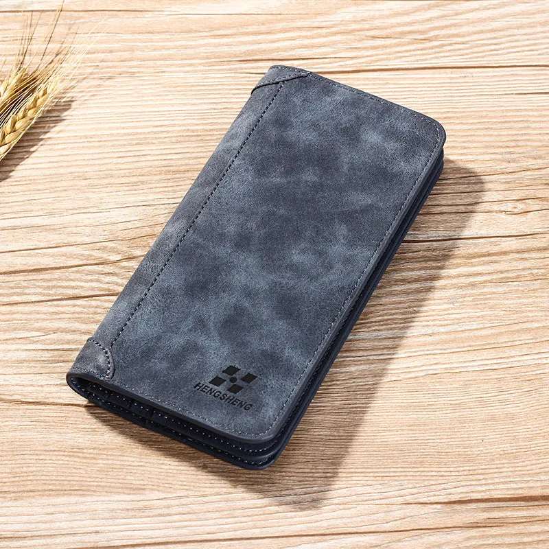 Long men's bi-fold PU leather wallet in brown with car suture stitching, open showing card slots and bill holder